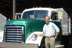 Gow Litzenburger pictured with one of 36 vintage fleet trucks still in operation at his Michigan landscape company.