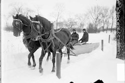 It was only 2 hp, but it got the job done plowing the snow back in 1903 in Lincoln Park, Chicago. What! No heated cab?! (Photo from the Library of Congress.)