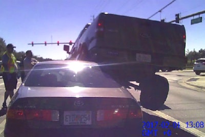 Police in Ocala. Fla. say the 18-year-old driver of this Ford pickup backed up on top of a car behind him to protect his family during a road rage incident.