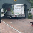 U-Haul truck stuck under historic covered bridge in Long Grove Illinois