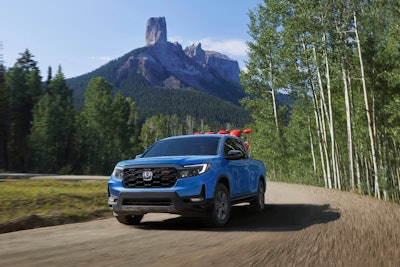 light blue 2024 Honda Ridgeline TrailSport mountains in background